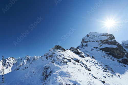 Beautiful view of Koscielec Peak - "Kościelec", High Tatra Mountains, Carpathian, Poland. The sun is shining over the top of the mountain. View from the Karb Pass.