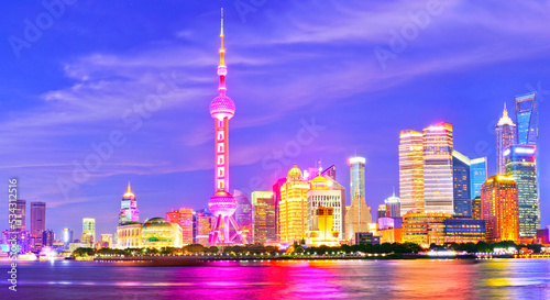 View of the skyline along the riverside at night in Shanghai, China.