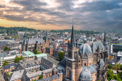 Sunset skyline of Aachen (Germany). Aerial view of Aachen Cathedral (German: Aachener Dom) with Katschhof square and Town Hall (Rathaus) in background