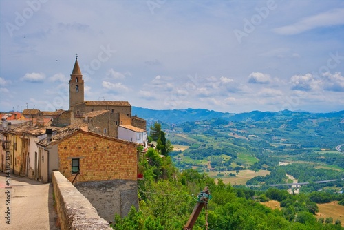 Gorgeous view of the town of Miano in Teramo, Abruzzo with lush green fields on a sunny day in Italy