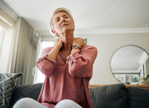 Senior woman, neck pain and stress in living room home of spine injury, fibromyalgia and osteoporosis. Sick, tired and fatigue lady in orthopedic, arthritis and health problem stretching body muscle