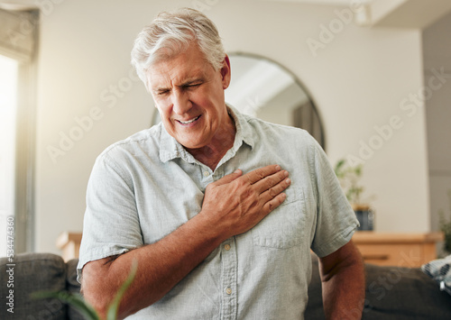 Senior man, heart attack and stroke at home for emergency health risk, breathing problem and cardiology accident. Sick elderly male with chest pain cancer, cardiovascular disease and heartburn injury