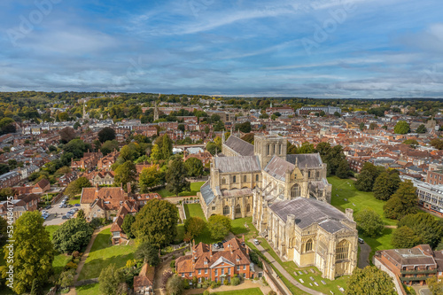 The drone aerial view of Winchester Cathedral and city, England. The Cathedral Church of the Holy Trinity, Saint Peter, Saint Paul and Saint Swithun, commonly known as Winchester Cathedral.