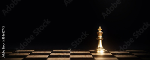 King chess stand on chessboard concept of challenge or team player or business team and leadership strategy or strategic planning and human resources organization risk management.