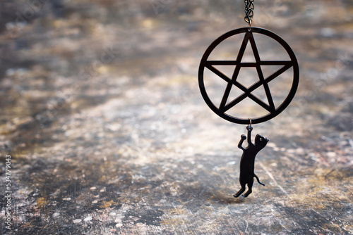 Pentagram necklace with small black cat pendant