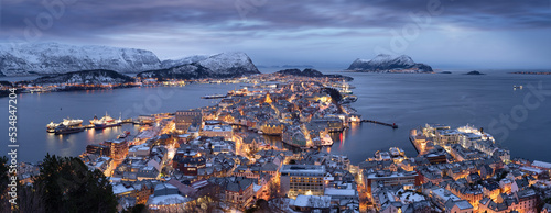 Panorama of Alesund in the snow on a winter evening, Norway