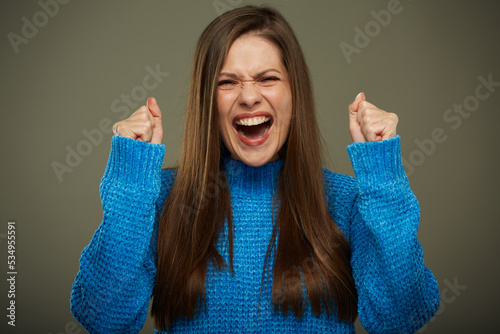 Agitated woman with winning close up isolated portrait.