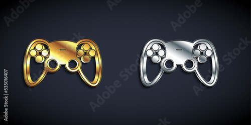 Gold and silver Game controller or joystick for game console icon isolated on black background. Long shadow style. Vector
