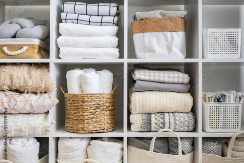 Bed linens closet neatly arrangement on shelves with copy space domestic textile Nordic minimalism