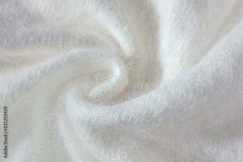 Swirl of White alpaca Fabric and mohair wool sweater texture.