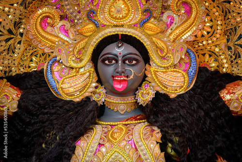 Idol of Goddess Maa Kali at a decorated puja pandal in West Bengal, India. Kali puja is a famous religious festival of Hinduism.