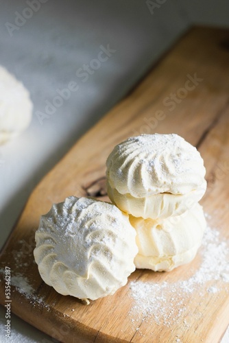 White zefir marshmallows sprinkled with powdered sugar