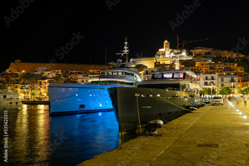 Huge yachts in the port of Ibiza at night
