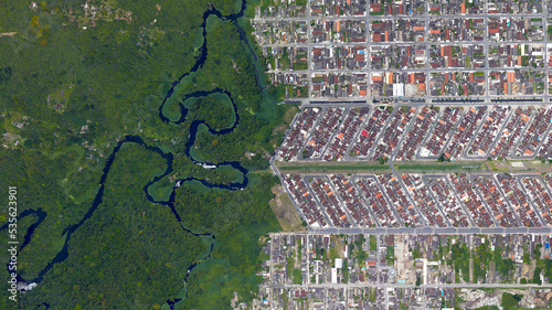 Forest, river and city border, forest and city separated by zigzag line, looking down aerial view from above – Bird’s eye view forest and city border Vila Caiçara, Praia Grande - Sao Paulo, Brazil