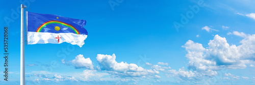 Pernambuco - state of Brazil, flag waving on a blue sky in beautiful clouds - Horizontal banner