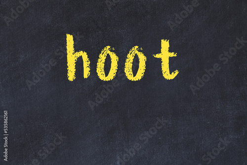 College chalk desk with the word hoot written on in