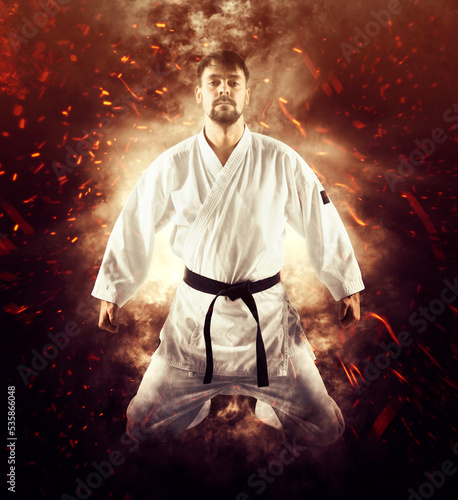 Martial arts masters on fire background