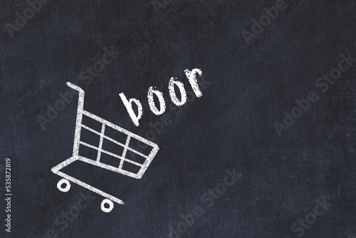 Chalk drawing of shopping cart and word boor on black chalboard. Concept of globalization and mass consuming