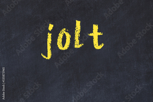 College chalk desk with the word jolt written on in