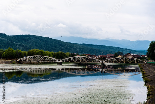 The old bridge over the Jiu river, also called Ferdinand's bridge because it was built between 1894 and 1895. Targu jiu, Romania.