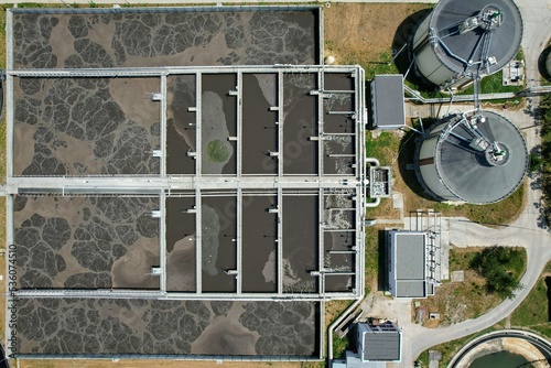 Aerial view of aeration tanks or activated sludge units, part of a water cleaning facility, at urban wastewater treatment plant