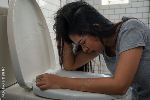 Woman drunk and vomit in bathroom