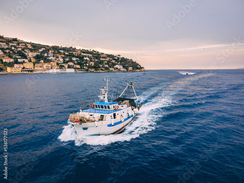 Fishing trawler coming back from the job next to the island in Italy