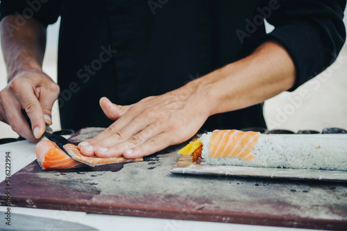 Chef cook making sushi outdoor