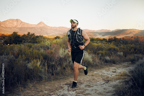 Fitness, training and exercise man running outdoor for a workout. Ambitious latino athlete run and exercising for a marathon. Male runner on nature trails jog to increase cardio health and wellness