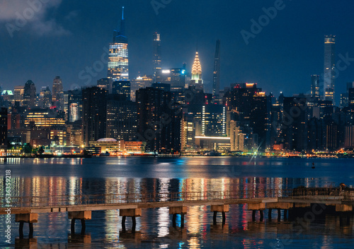 city skyline at night beautiful New York river reflections sunrise