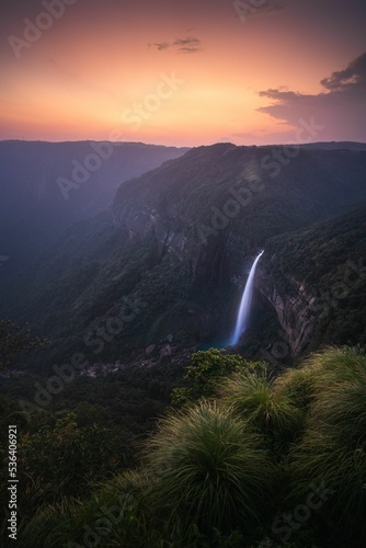 Vertical shot of Nohkalikai Falls at sunset. State of Meghalaya, India.