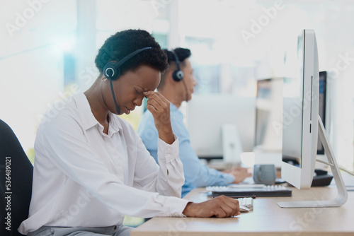 Headache, stress and burnout call centre woman consultant, telemarketing agent and customer support staff in office. Frustrated, sick and problem consulting worker in pain, mistake and desktop glitch