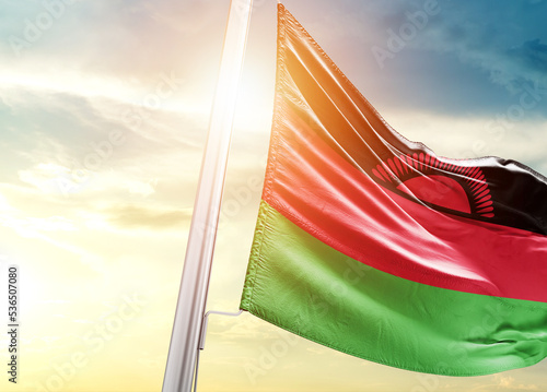 Malawi national flag cloth fabric waving on the beautiful sunlight - Image