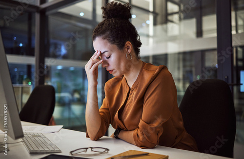 Woman working at night with headache, burnout and stress over social media marketing project or company deadline. Anxiety, exhausted and tired web or online business advertising expert with migraine