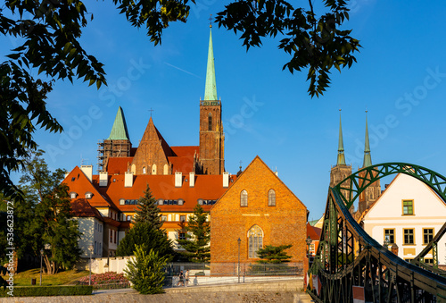 Panoramic view of Ostrow Tumski Island with Holy Cross collegiate cathedral over Odra river in historic old town quarter of Wroclaw in Poland