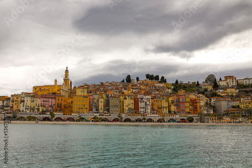 Old town and architecture of Menton on the French riviera during a cloudy spring day.