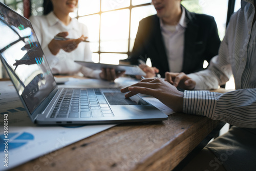 Team of business investment consultant analyzing company annual financial report working with documents pie and donut chart, using laptop, Business and Financial concept.