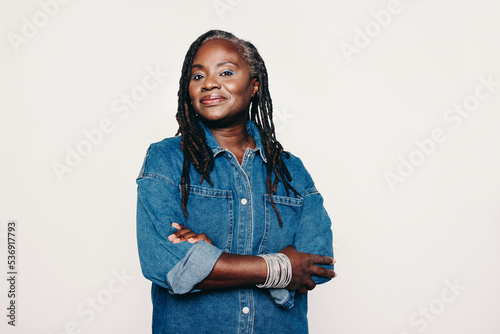 Stylish mature woman looking at the camera in a studio