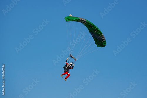 Parachute in the sky. Skydiver is flying a parachute in the blue sky.