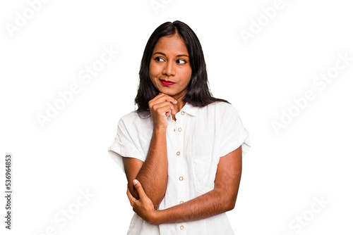 Young Indian woman isolated looking sideways with doubtful and skeptical expression.