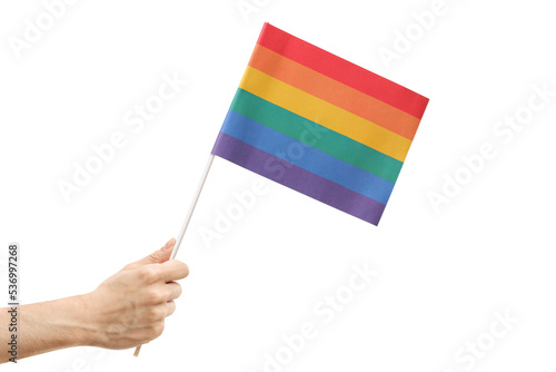 Male hand holding a rainbow flag