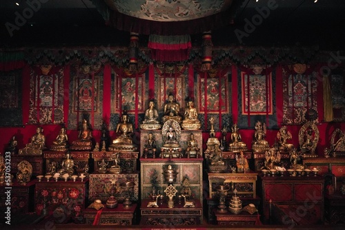 Buddhist altar with many icons, statues, drawings and symbols