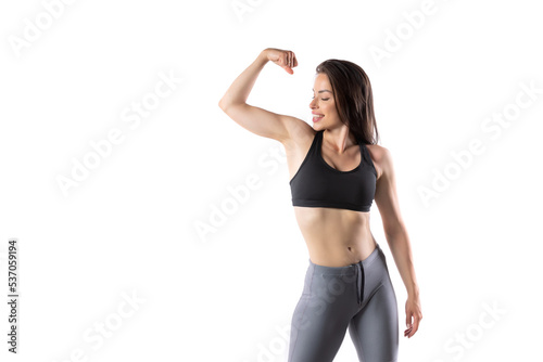 Beautiful fitness girl posing flexing
