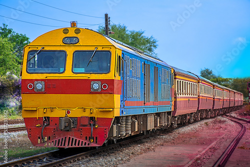 Passenger train by diesel locomotive at the railway station