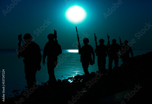 Army soldiers with rifles moon night silhouette