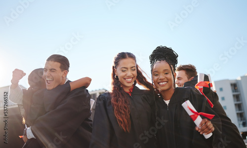 Graduation, diploma celebration and student graduate group and friends together with proud success. Students at a university certificate achievement, college and education scholarship event