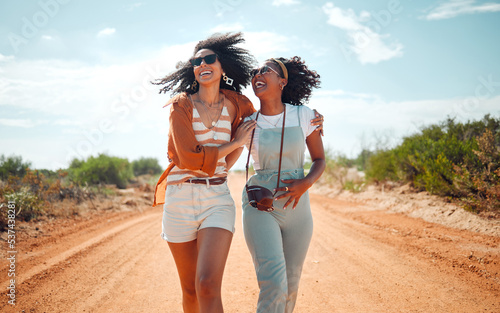 Walking, happy and friends on holiday at a safari during summer together in nature of Kenya. Happy, playful and young African women on vacation in the desert for travel, freedom and adventure