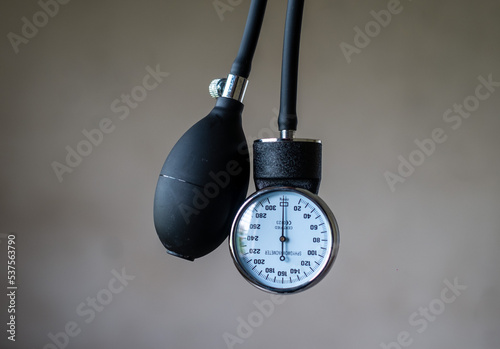 close up image of aneroid manometer and inflation tube of a sphygmomanometer 