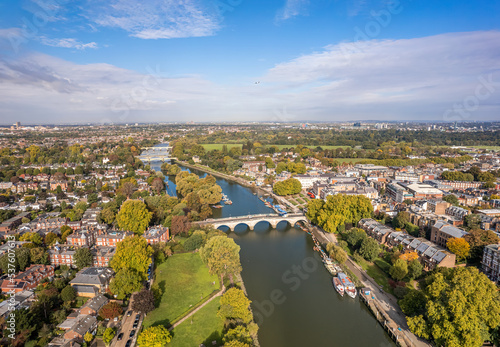 The aerial view of Thames river runs through Richmond town centre on the east bank with its neighbouring district of East Twickenham to the west, London.