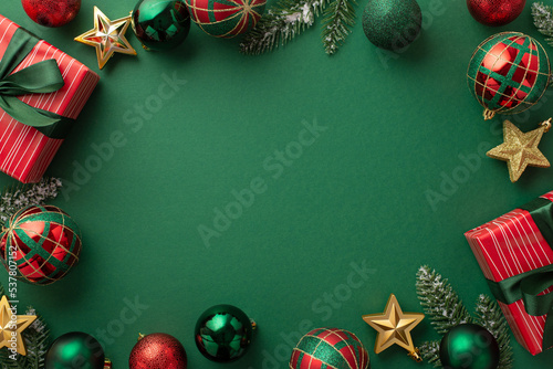 Christmas Eve concept. Top view photo of gift boxes with ribbon bows green red baubles gold star ornaments and pine branches on isolated green background with copyspace in the middle